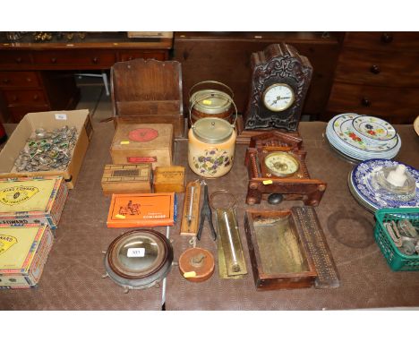 A mantel with replacement quartz movement, thermometers, cribbage board, biscuit barrels, glove stretchers, vintage leather t