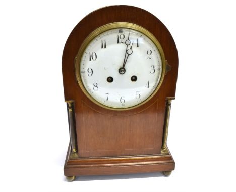 AN EDWARDIAN MAHOGANY MANTLE CLOCK  with enamel dial, the 8-day movement stamped 'Japy Freres', striking on a coiled gong, 22