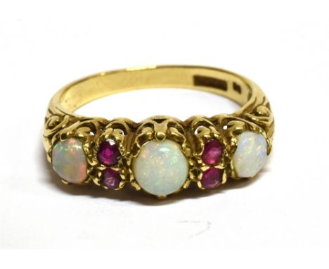 AN OPAL THREE STONE AND RUBY SET 9 CARAT GOLD DRESS RING ring size O, gross weight 3.0 grams Condition Report : Condition: ve