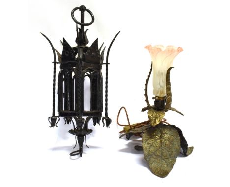 A CAST METAL TABLE LAMP  naturalustically modelled, with glass shade, 34cm high overall; and a wrought iron hanging lantern, 