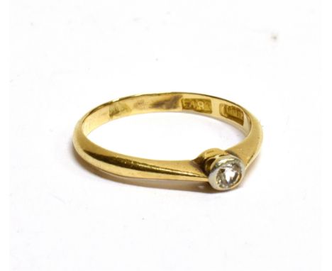 AN 18CT YELLOW GOLD RING with a small diamond approx. 0.10 carat, rub over setting, ring size K, approx. 1.8 grams Condition 