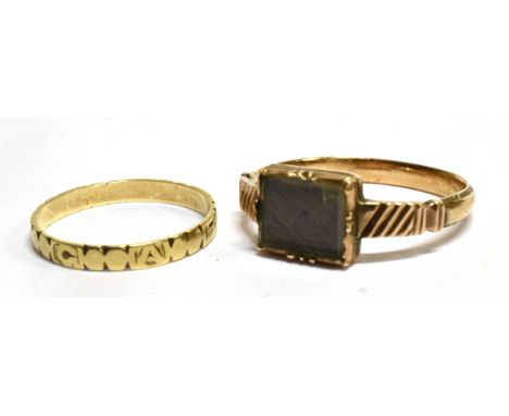 AN EARLY VICTORIAN MOURNING RING  dated 1838, comprising a glazed rectangular front head containing plaited hair, rub over se