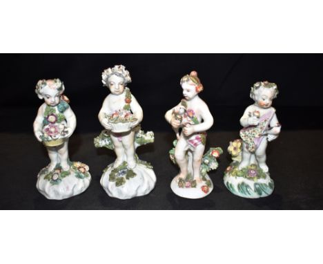 THREE 18TH CENTURY BOW FIGURES OF PUTTI  each typically modelled with floral headdresses and sashes, and another similar, the