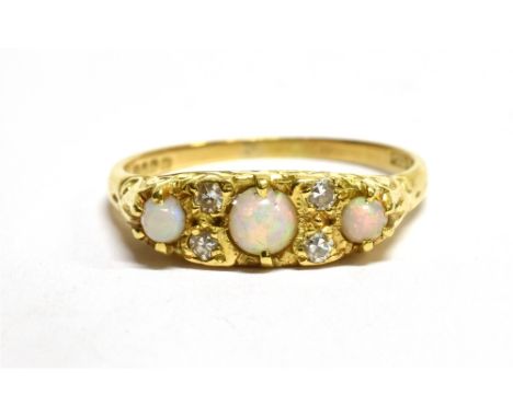 AN 18 CARAT GOLD OPAL THREE STONE AND DIAMOND SET BOAT HEAD RING  hallmarked 1963, ring size N ½, gross weight 3.6 grams. Con