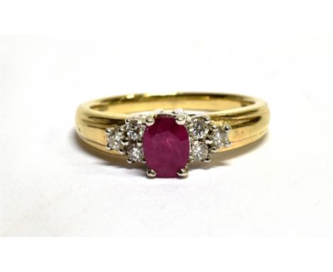 A RUBY AND DIAMOND SEVEN STONE CLUSTER 9 CARAT GOLD RING ring size N, gross weight 3.4 grams. Condition Report : Condition: g