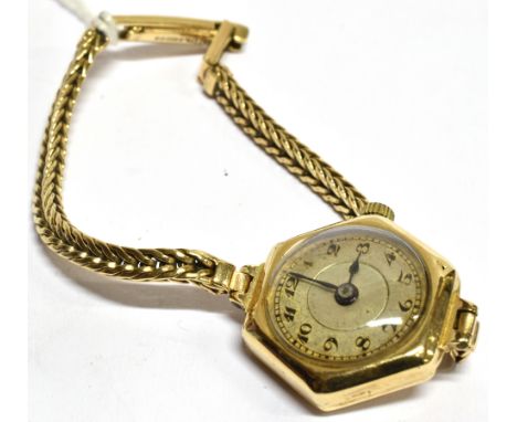 A LADIES 9 CARAT GOLD VINTAGE WRISTWATCH  and 9 carat gold bracelet, small round steel dial, hexagonal 9 carat gold case to i