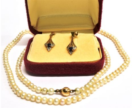 A PAIR OF 9 CARAT GOLD SAPPHIRE SET DROP EARRINGS  central blue sapphire to lozenge shaped yellow gold drops, tiny diamonds t