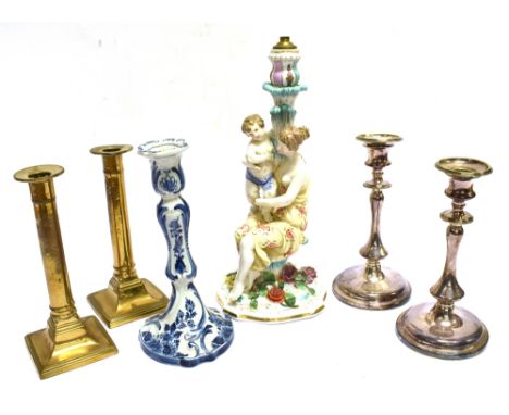 A CONTINENTAL FIGURAL CANDLESTICK  modelled as mother and child, 34cm high, a Dutch Delft candlestick 24.5cm high and two fur