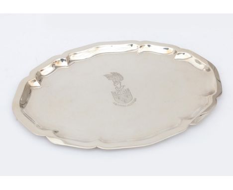  A Dutch 2nd grade half oval silver Chippendale tray with a contoured edge, centrally engraved with a family crest and below 