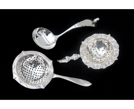  A pair of 2nd grade silver tea strainers and a silver cream spoon. First half of the 20th century. Weight: 53.8 g. L. 12 cm.