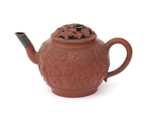  A silver mounted yixing tea pot with relief chrysantemus decoration and a pierced lid, Kangxi, first half 18th century. Defe