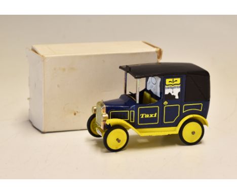 Dinky Toys United Biscuits Taxi Diecast in yellow and blue, with original white card box