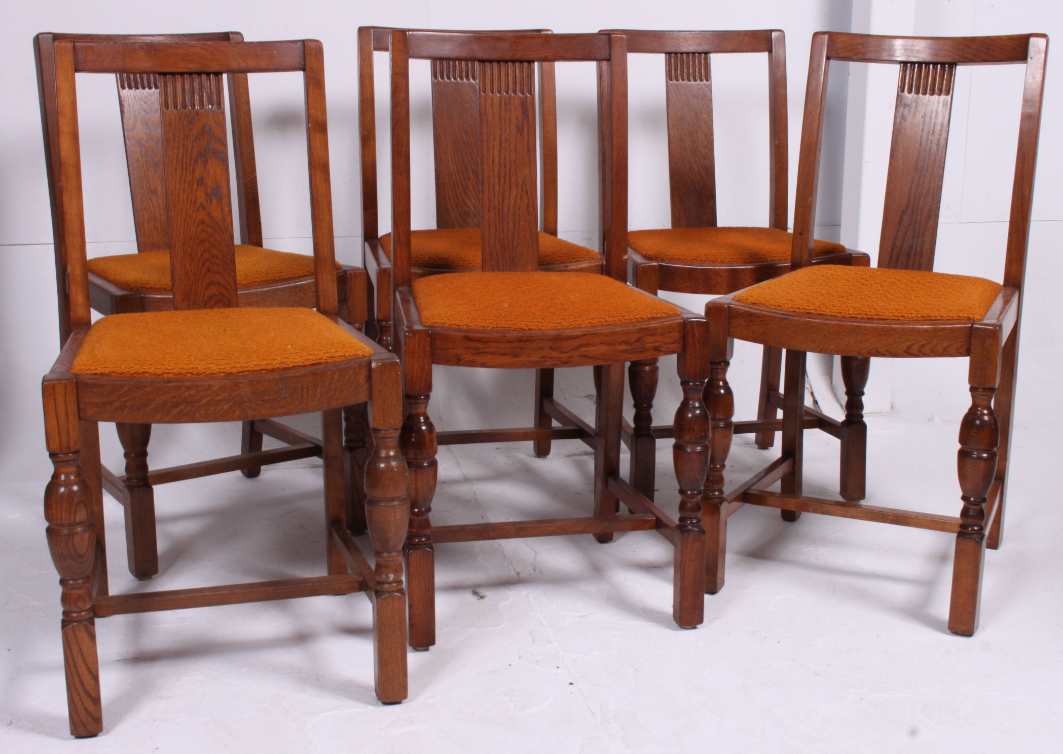 A set of 6 1940's CC utility marked Art Deco oak dining chairs. Raised