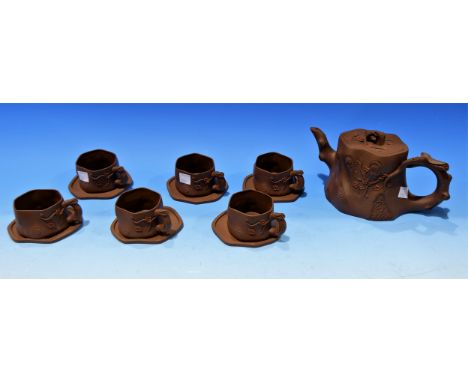 A Chinese Yixing style tea set in brown bisque porcelain, comprising teapot and 6 cups and saucers, seal marks