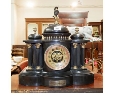 A black slate architectural mantel clock, with French 8 day striking movement, bears silver presentation plaque dated 1900, w