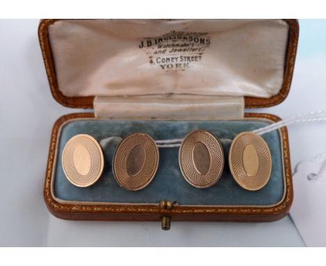 A pair of 9 carat hallmarked gold oval engine turned cufflinks, 8.1 gm