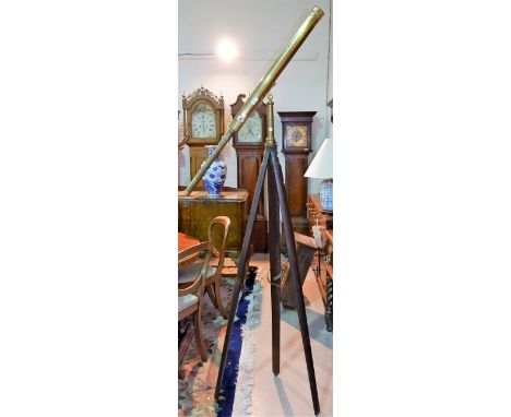 A 19th century brass Library Telescope with folding tripod mount and full height mahogany tripod, with extra lens, mahogany c