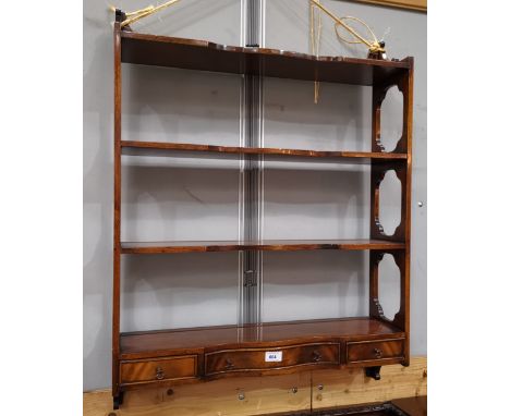 A mahogany 3 height wall shelf in the Reprodux manner, with 3 small drawers