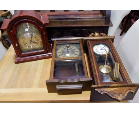 A mahogany Georgian style bracket clock with striking movement; a modern Vienna style wall clock; and another