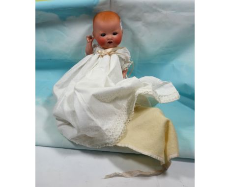 A German bisque headed doll by Armand Marseille, stamp to back of head 'A&amp;M Germany 351/2 k', full length 11½"