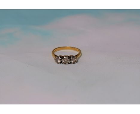 An 18 carat gold dress ring set 3 diamonds