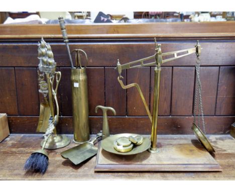 A set of 19th century brass scales and weights; a shell case; a spirit kettle; etc.
