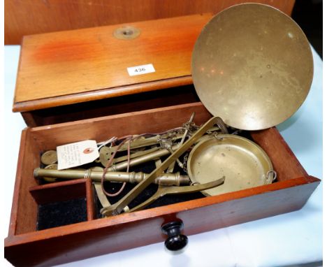 A 19th century mahogany cased portable brass apothecary scales, with weights, width 14"