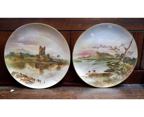 A pair of ceramic plaques depicting Kilarney scenes by John Capey