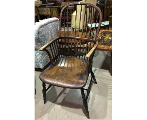 A 19th century elm and beech Windsor armchair with comb back; a 19th century ladder back armchair with rush seat