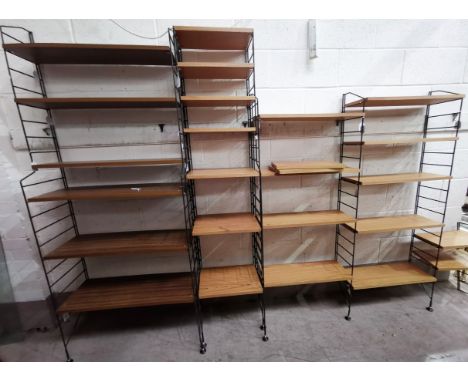 A Ladderax style wall shelf unit, 4/5 sections with metal uprights and teak effect shelves