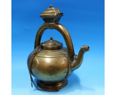 An 18th/19th Indian brass heavy brass teapot, on circular foot, raised handle with small covered compartment 10.5" height
