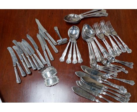 Three hall marked silver decanter labels, two sets of six silver handled knives and a part canteen of kings patter cutlery