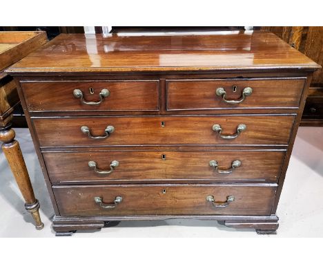 A Georgian mahogany bachelors chest of three long and two short drawers on bracket feet with swan neck handles