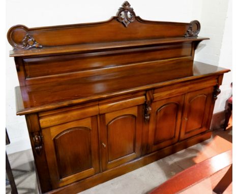 A mahogany Victorian style 4 door sideboard with 4 frieze drawers, raised back with display shelf over