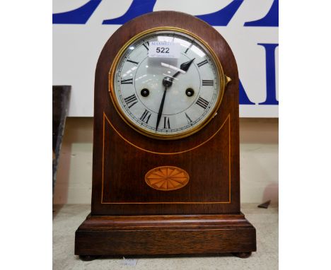 An Edwardian inlaid mahogany mantel clock with arch top and strike