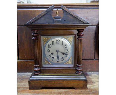 A 1920's mahogany case chiming mantel clock 