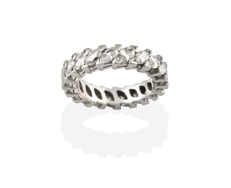 A Diamond Eternity Ring, the twenty marquise cut diamonds in white claw settings, total estimated diamond weight 2.40 carat a