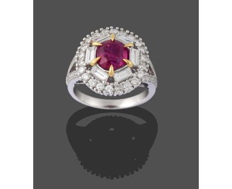 A Ruby and Diamond Cluster Ring, the oval cut ruby in a yellow claw setting, within a border of six baguette cut diamonds, to