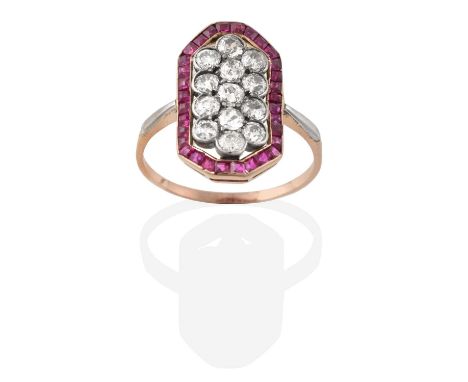 A Ruby and Diamond Ring, the central cluster formed of old cut diamonds in white collet settings, to an openwork border of ca