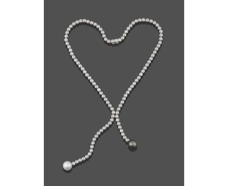A Diamond and Cultured Pearl Négligée Necklace, the chain formed of round brilliant cut diamonds in white rubbed over setting