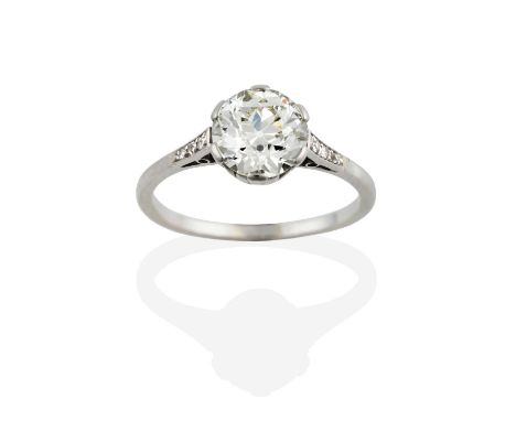 A Diamond Solitaire Ring, the old cut diamond in a white claw setting, to an old cut diamond set shoulder plain polished shan