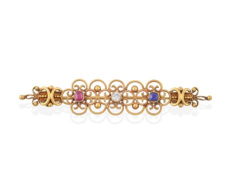 A Sapphire, Ruby and Diamond Brooch, by John Brogden, circa 1880, the yellow tapered open wirework and beadwork frame with an