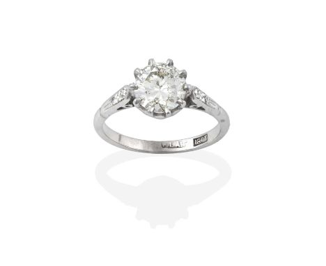 A Diamond Solitaire Ring, the round brilliant cut diamond in white claw settings, to an eight-cut diamond set shoulder plain 