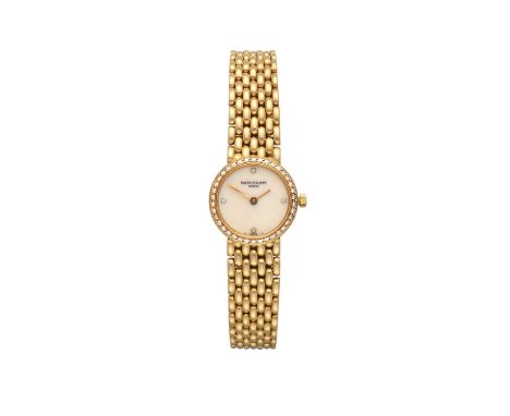 A Lady's 18 Carat Gold Diamond Set Wristwatch, signed Patek Philippe, Geneve, ref: 4707/11, 1986, (calibre E15) quartz batter