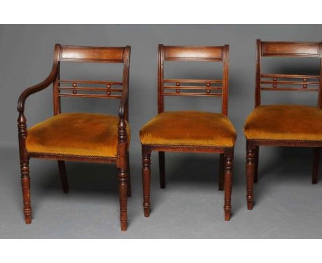 A SET OF EIGHT (6 + 2) GEORGIAN MAHOGANY DINING CHAIRS, early 19th century, the reeded uprights enclosing a panelled top rail