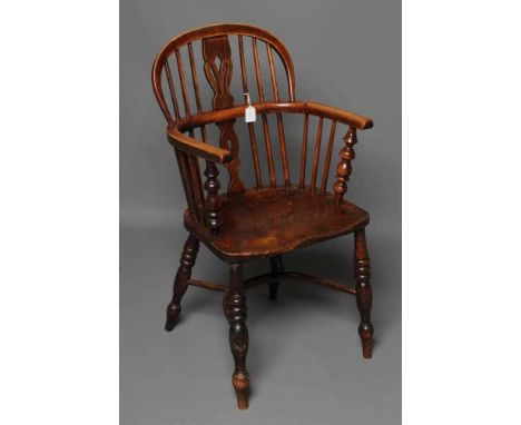 AN ASH AND ELM WINDSOR ARMCHAIR, Lincolnshire, mid/late 19th century, of low hoop back form with fleur de lys splat, baluster