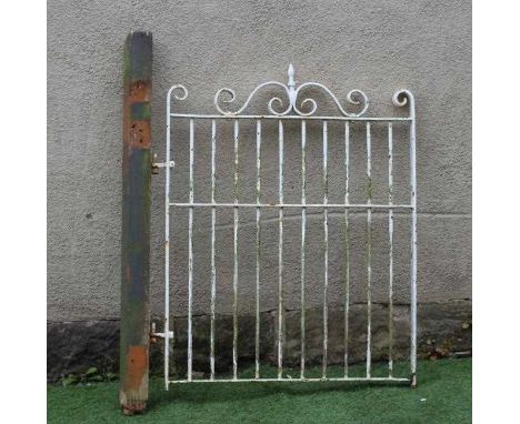 A CAST AND WROUGHT IRON PEDESTRIAN BARRED GATE, the scrolled surmount with turned finial, 32 1/4" (34" including hinges) x 42