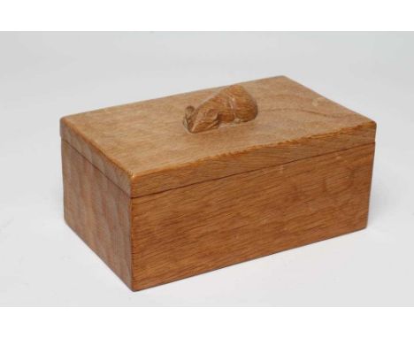 A ROBERT THOMPSON ADZED OAK TRINKET BOX of oblong form, the lift-off cover centred by carved mouse trademark in high relief, 