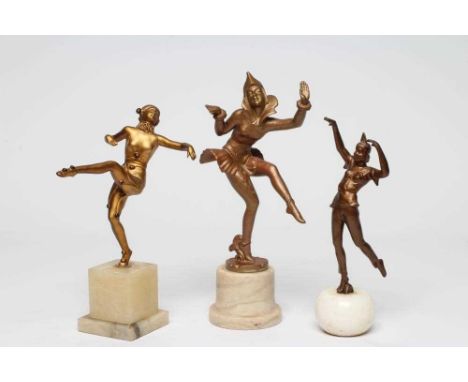 AFTER GERDA IRA GOTTSTEIN (GERDAGO)- an Art Deco spelter figure of a dancing Harlequin, 8" high, on an onyx stand, together w