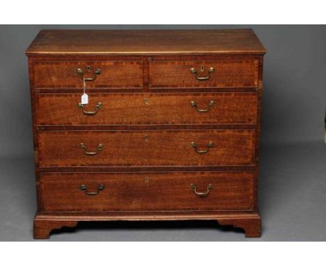 A GEORGIAN OAK STRAIGHT FRONT CHEST, early 19th century, with mahogany and rosewood banding, three short over three long cock